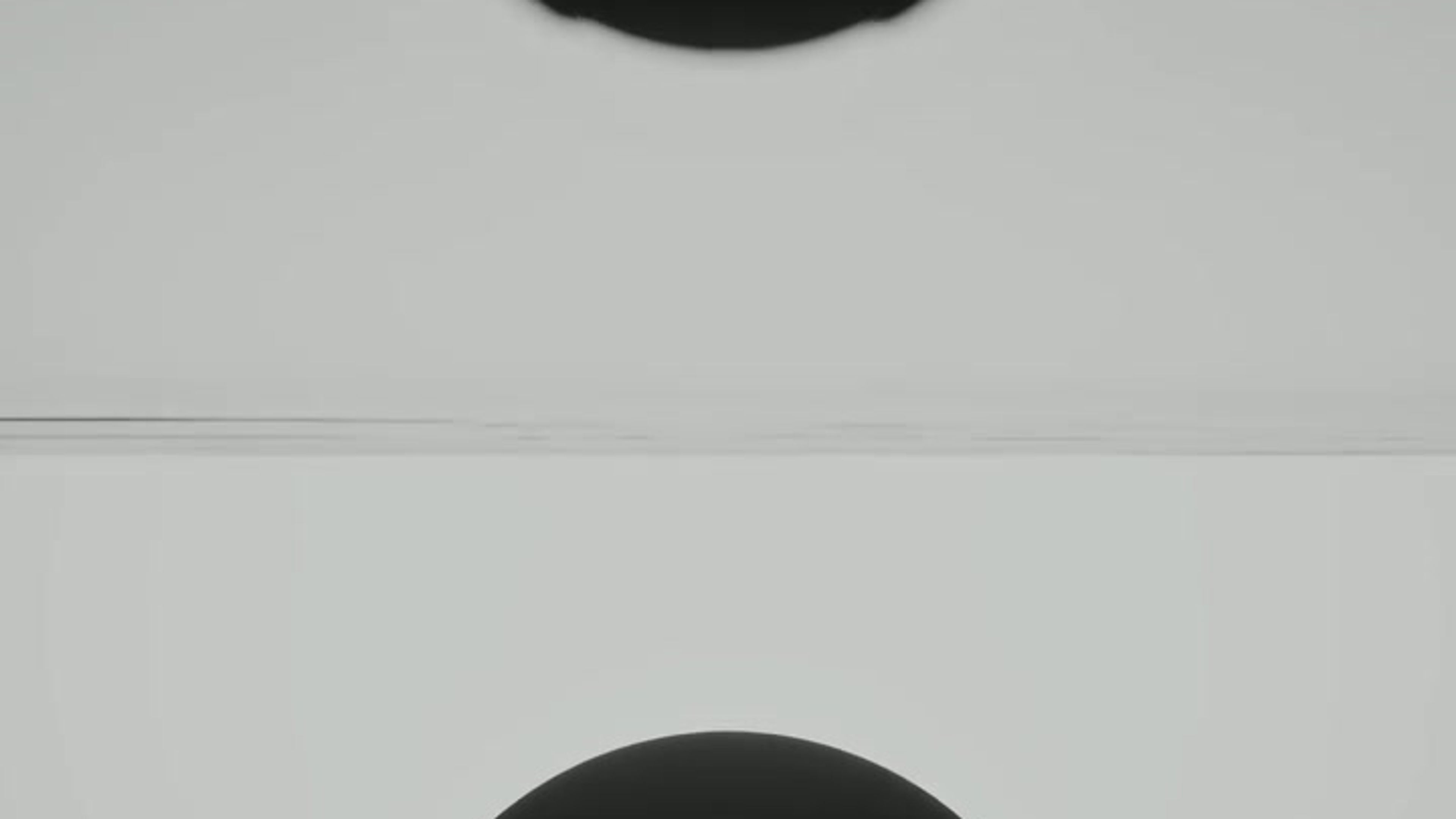 Dissolution of DualityA black sphere, where matter merges with shadow, dissolves into a plane o